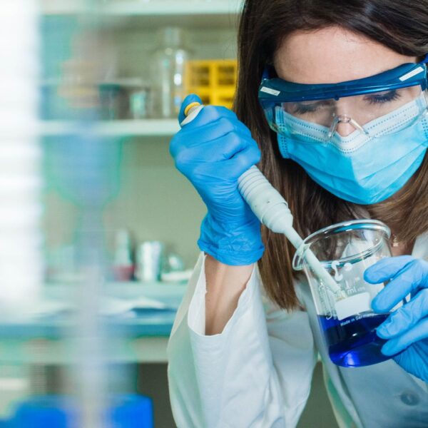 a scientist working with chemicals