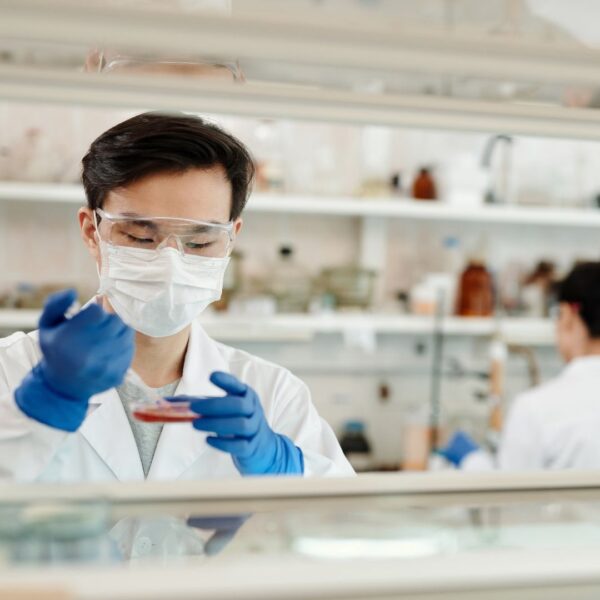 a scientist working in the lab, testing things